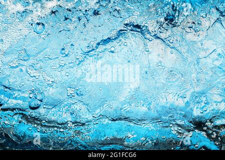 Blue fresh ocean water. Background of transparent sea water and