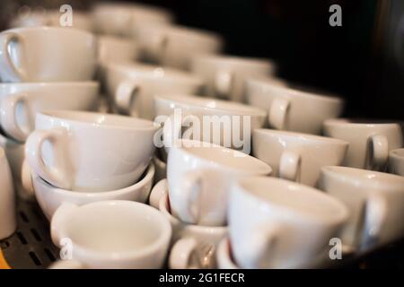 Close up shot of a stack of empty white coffee cups. Stock Photo