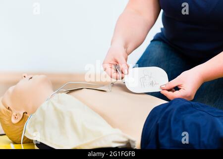 Woman in first aid class training reanimation Stock Photo