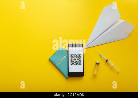 Green passport coronavirus Qr code on smartphone screen, Vaccine syringe covid 19, paper plane. Digital certificate Corona vaccine pass. Free Stock Photo