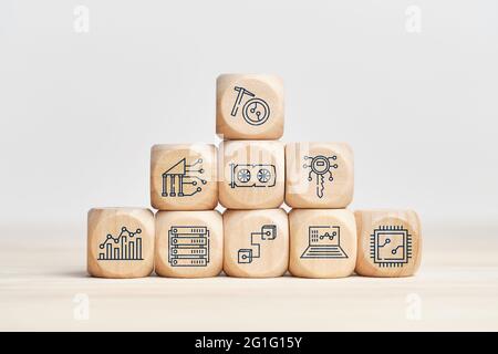 Cryptocurrency mining business concept with icons on wooden blocks. Stock Photo