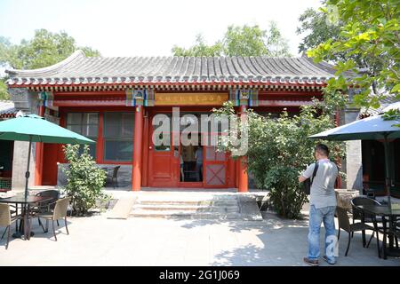 Tourist and Courtyard in entrance to Artist Qi Baishi's house and workshop in Xicheng District Beijing, Peoples Republic of China. Stock Photo