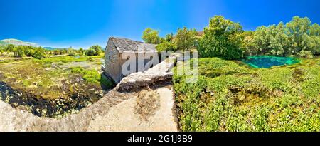 Old stone mill ruins on Cetina river source panoramic view, Dalmatian Zagora region of Croatia Stock Photo