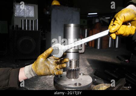 Workers teamwork inside the factory. Industrial background. Stock Photo