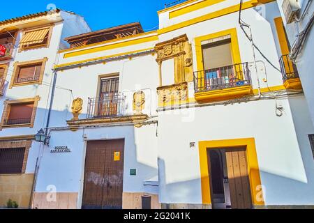 CORDOBA, SPAIN - SEPTEMBER 30, 2019: The narrow old Calle Barroso street with historic housing and Bodega San Rafael wine house, on September 30 in Co Stock Photo