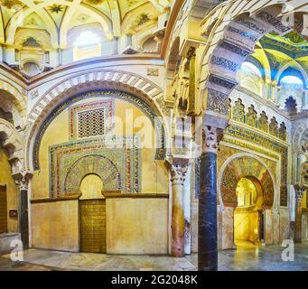 CORDOBA, SPAIN - SEP 30, 2019: The maqsura (caliph's or emir's praying area) of Mezquita with ornate alfiz (blind arcade) and mihrab, decorated with m Stock Photo