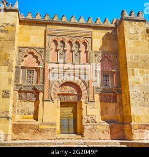 Puerta del Espiritu Santo gate of Mezquita has splendid decors - alfiz (blind arcade), polylobed window arches, horseshoe arch over the door, Islamic Stock Photo