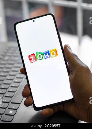 Assam, india - May 29, 2021 : Zoho logo on phone screen stock image. Stock Photo