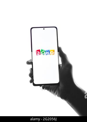 Assam, india - May 29, 2021 : Zoho logo on phone screen stock image. Stock Photo