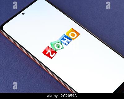Assam, india - May 29, 2021 : Zoho logo on phone screen stock image. Stock Photo