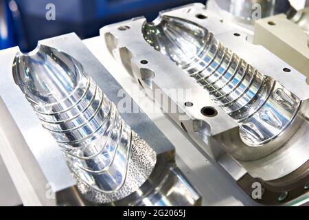Metal molds for making plastic bottles Stock Photo
