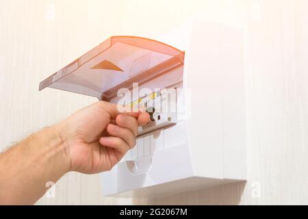 Protection of electrical installation setting the switchboard, switch on by hand Stock Photo