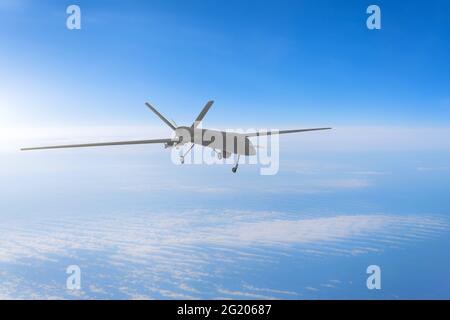 Unmanned military drone on patrol air at high altitude Stock Photo