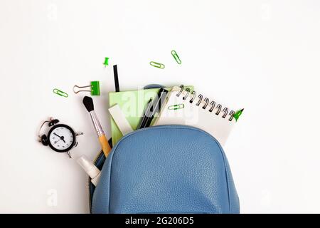 Student's backpack with different stationery and study supplies Stock Photo
