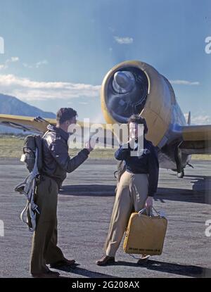 Unidentified Women's Air Force Service Pilot and male instructor stand in front of a Republic P-47, no location, circa 1944. (Photo by US Army Air Force/RBM Vintage Images) Stock Photo