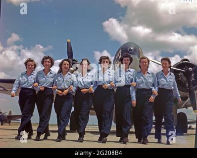 A group of eight female pilots, members of the Women's Air Force Service Pilots, walk along the ramp at the AAF Training Command's Advanced single engine pilot school at Foster Field. Left to right: Pauline S Cutler; Dorothy Ehrhardt; Jennie M Hill; Etta Mae Hollinger; Lucille R  Carey; Jane B Shirley; Dorothy H Beard; and Kathryn Boyd, Victoria, TX, 1944. (Photo by US Army Air Force/RBM Vintage Images) Stock Photo