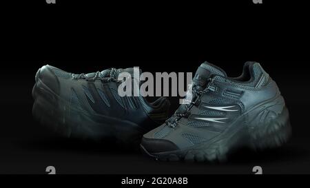 Closeup on a pair of blue gray fabric and leather sports shoes one in front of the other with walking effect on black background Stock Photo