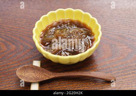 Freshly small fish pickled in soy sauce in a fishing boat. Japanese delicacy food called Sirasu no okizuke. Stock Photo
