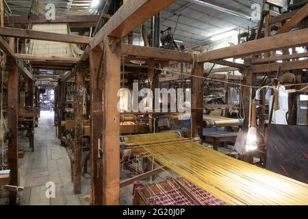 Traditional Bevilacqua weavers workshop, handycraft women work on more than 200 years old wooden loom weavings, in Venice since 1875 . Stock Photo