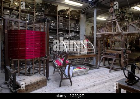 Traditional Bevilacqua weavers workshop, handycraft women work on more than 200 years old wooden loom weavings, in Venice since 1875 . Stock Photo