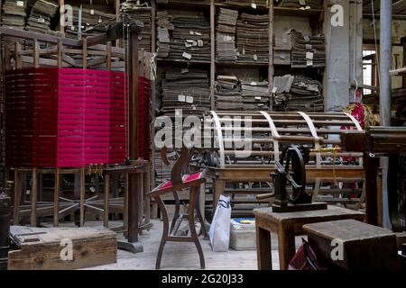 Traditional Bevilacqua weavers workshop, handycraft women work on more than 200 years old wooden loom weavings, in Venice since 1875 . Stock Photo