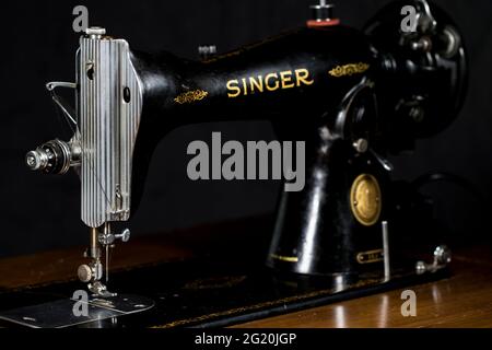 Vintage sewing machine close up singer 15-91. Black and gold detailed retro Singer sewing machine. Stock Photo