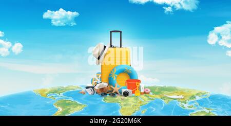 Travel time concept composition with bag and travel items on world map Stock Photo