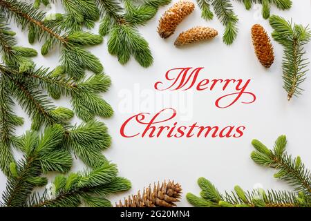 Christmas card, Merry christmas lettering on a white background, decorative layout Stock Photo