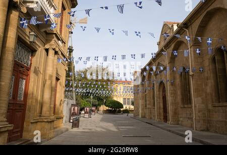 Waving greek flags for celebration of Greece independence in Leadra street, Nicosia Cyprus Stock Photo