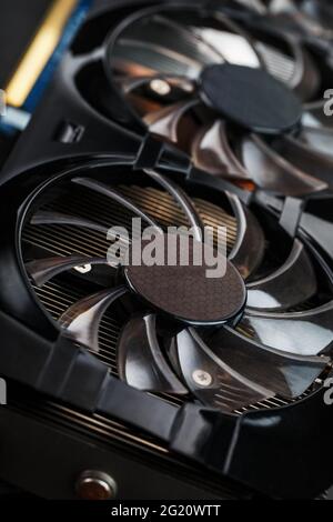 Video card cooling system cooler close-up. Progressive cooling system for the video chip, processor and memory. Selective focus, macro Stock Photo