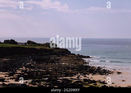 View of Mans Head peninsula from Porthmeor beach, St. Ives, Cornwall, UK, May 2021 Stock Photo