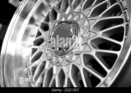 Silver alloy wheels on a car, close-up. Purchase and replacement of autodisks. Stock Photo