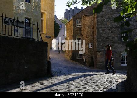 Colors and soft light reflections emphasizing the texture on the walls of the historical buildings along the creek walking route Stock Photo