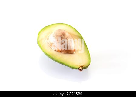Avocados on a white background. Stock Photo