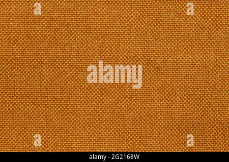 Background image - textured natural rough fabric of brown color. Stock Photo