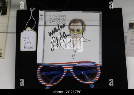 Beverly Hills, USA. 07th June, 2021. Music Icons auction memorabilia at Julien's Auctions. 6/7/2021 Beverly Hills, CA USA Elton John signed CD and glasses. (Photo by Ted Soqui/SIPA USA) Credit: Sipa USA/Alamy Live News Stock Photo