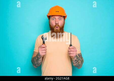 Incompetent worker is afraid and worried about his work Stock Photo