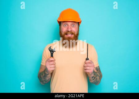 Incompetent worker is unsure and confused about his work Stock Photo
