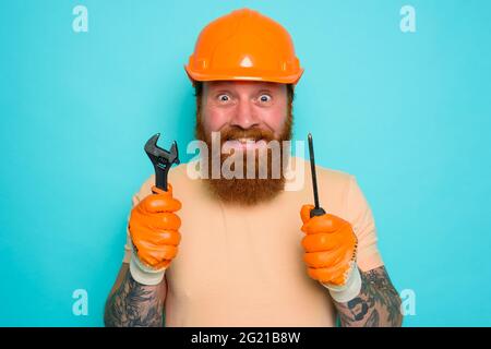 Incompetent worker is afraid and worried about his work Stock Photo