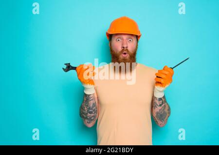 Incompetent worker is afraid and worried about his work Stock Photo