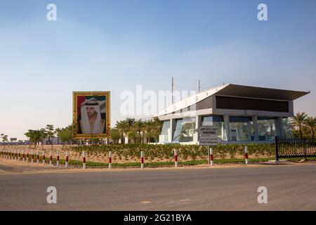 A large image of Sheikh Hamdan next to the visitor centre at Al Marmoom Camel Race track, Dubai, UAE Stock Photo