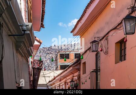 Looking up at the densely populated hills of La Paz, Bolivia from the historic street Calle Jaen Stock Photo