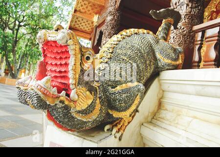 Chiang Mai, Thailand - December 17, 2020: Mythical Mom guardian is an imaginary animal shaped like a lion mixed with a dragon decorated in Wat Phra Th Stock Photo