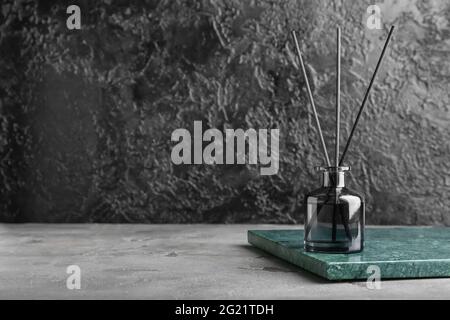 Reed diffuser on dark background Stock Photo
