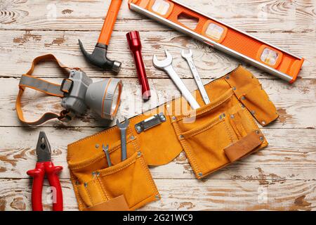 Safety equipment on light wooden background Stock Photo