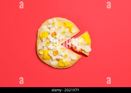 Creative composition with tasty pizza and narcissus flowers on color background Stock Photo