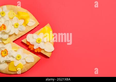 Creative composition with tasty pizza and narcissus flowers on color background Stock Photo