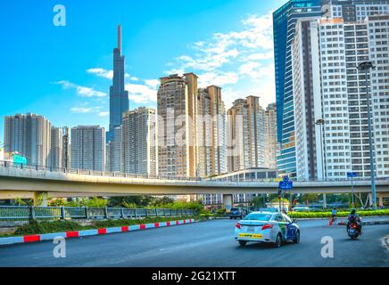 Picture of Traffic on the bridge next to the riverside high-rise urban area ...
