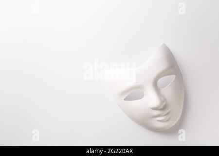 Theater or carnival concept - white mask on white background with copy space for text Stock Photo