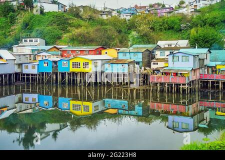 View of Colorful houses on stilts at the water edge, in Castro, Chiloe Island. Chile Stock Photo